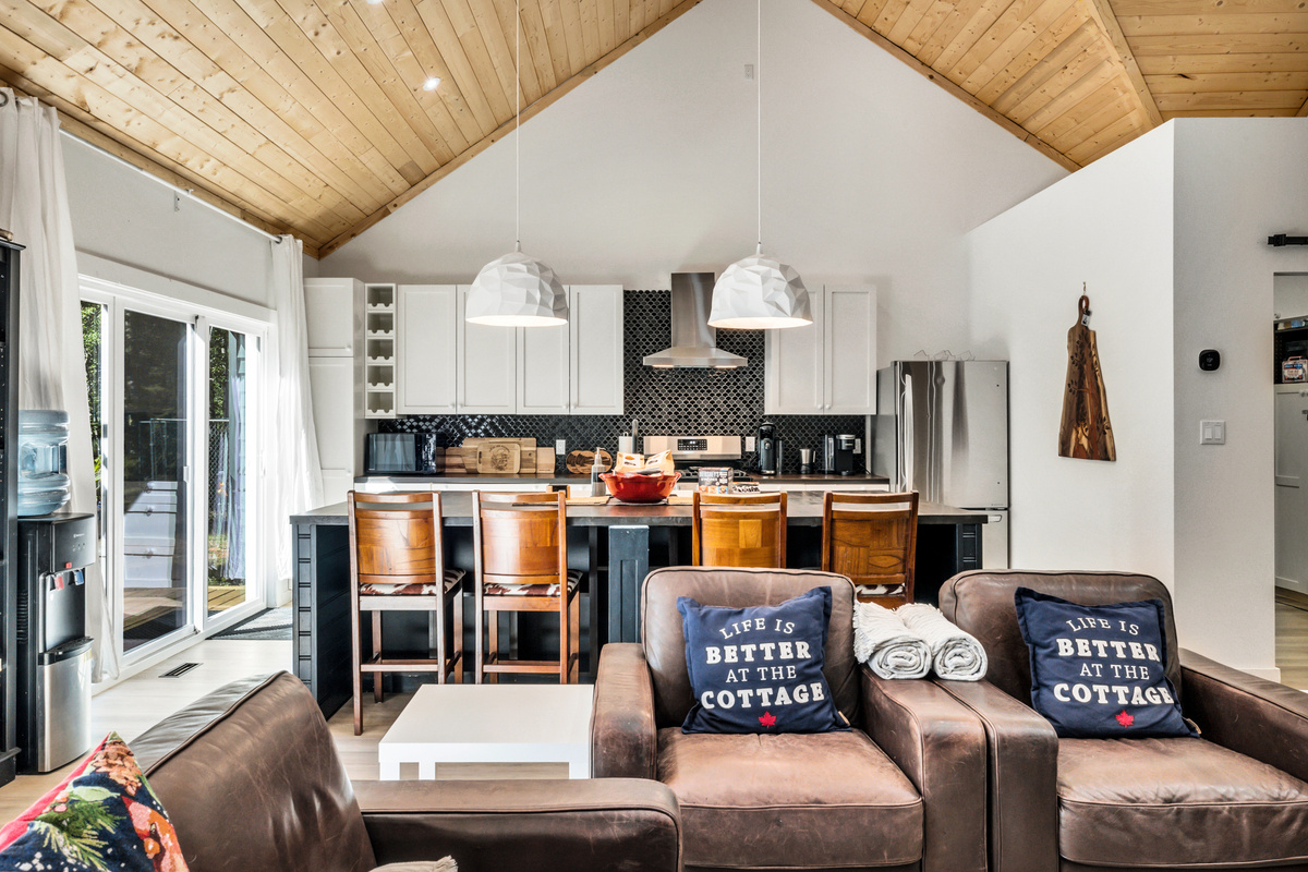 The open layout keeps everyone connected, whether you're cooking at the island, relaxing on the sofa, or planning the day's adventures.