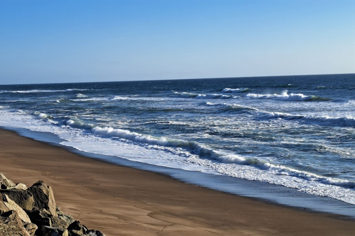 Stretch your legs and soak up the sun along seven miles of pristine sandy beach.