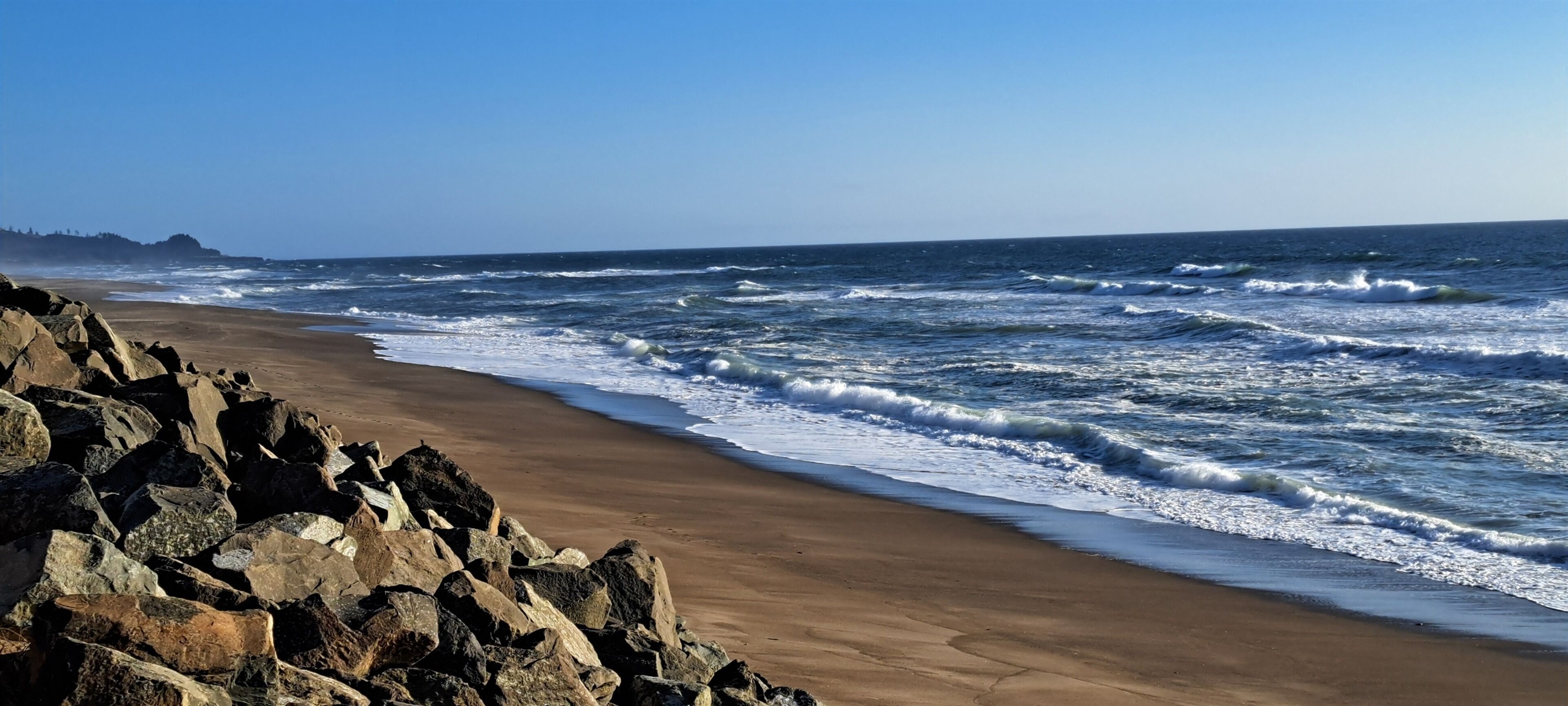 Stretch your legs and soak up the sun along seven miles of pristine sandy beach.