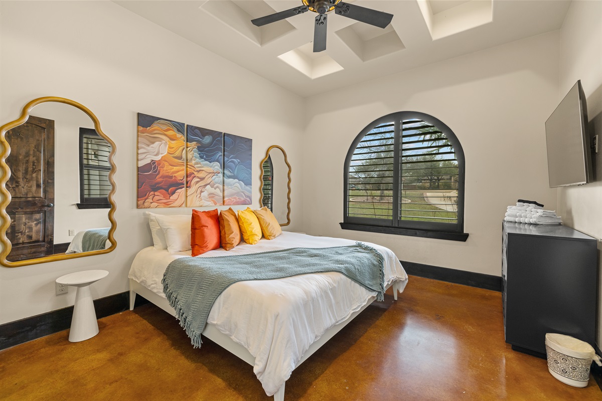 "Step into serenity with this stunning first-floor retreat, where elegance meets tranquility. ✨🌿 Gaze out at the lush courtyard through expansive windows." Bedroom 2