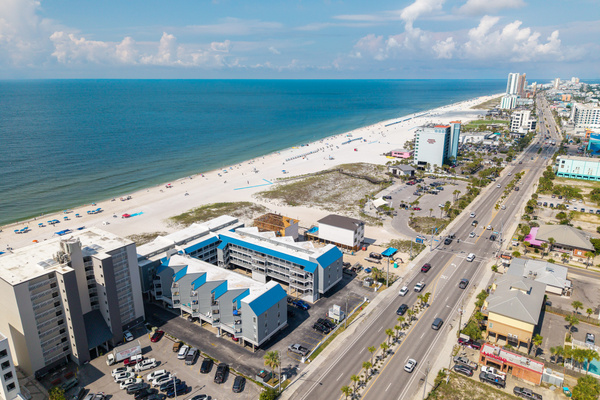 Aerial view showing the building's prime spot along the Gulf Shores coastline