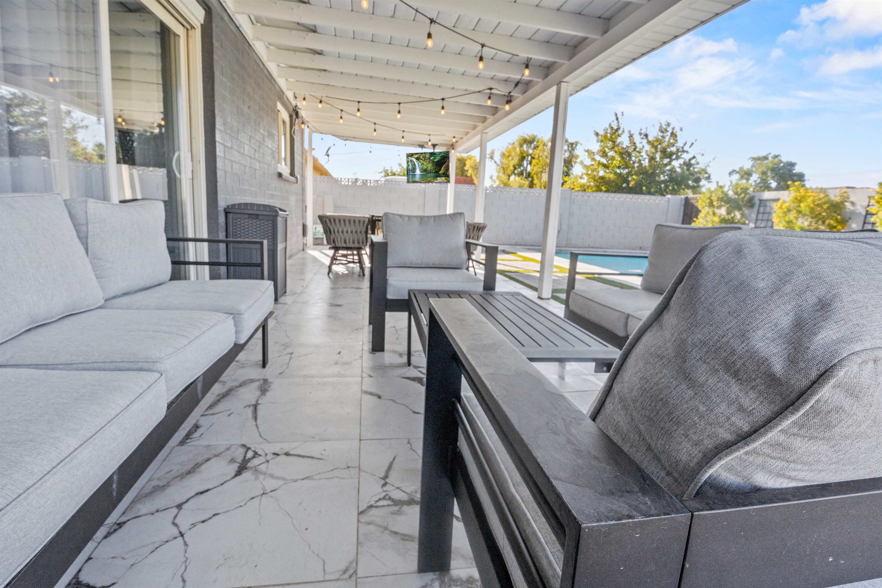 Grill up dinner on the BBQ, serve at the shaded dining set, and watch string lights glow as the desert cools.