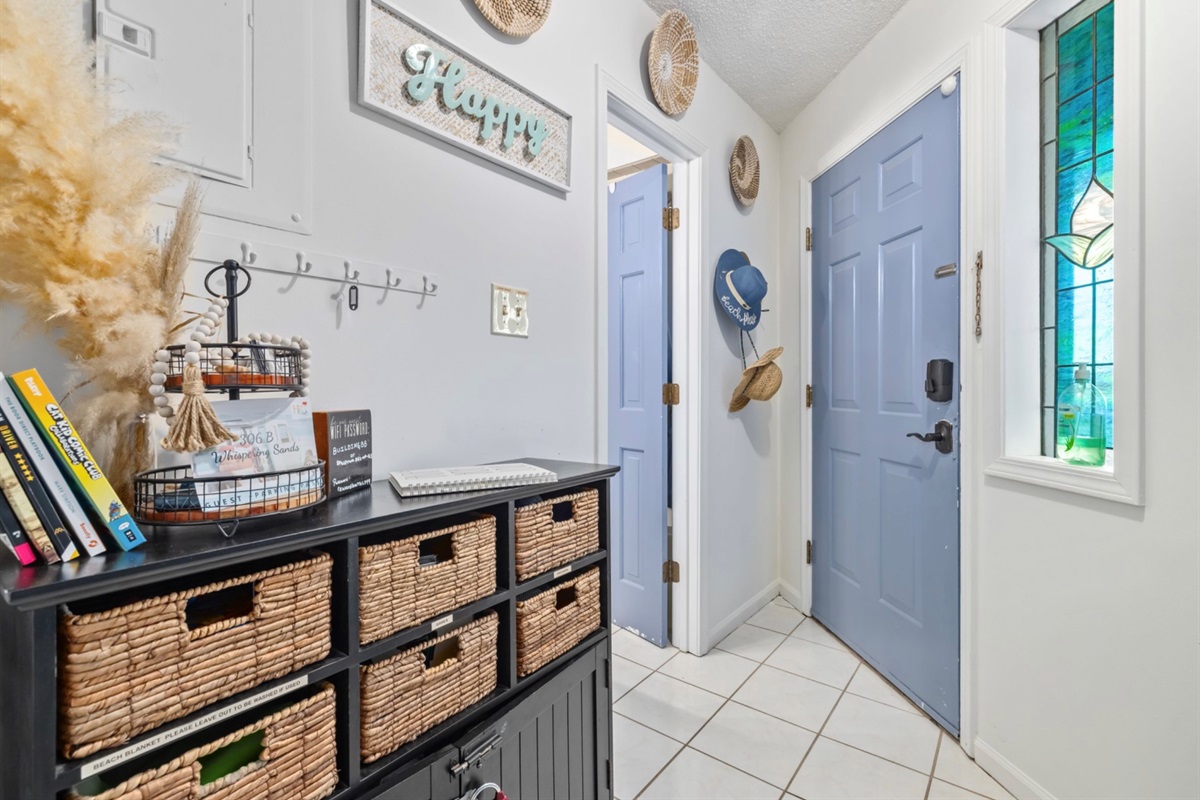 Welcoming entry way with Parking passes conveniently placed on the entry table for easy grab-and-go. It’s also the perfect landing spot for your keys and sunglasses — simple, organized, stress-free from the moment you arrive