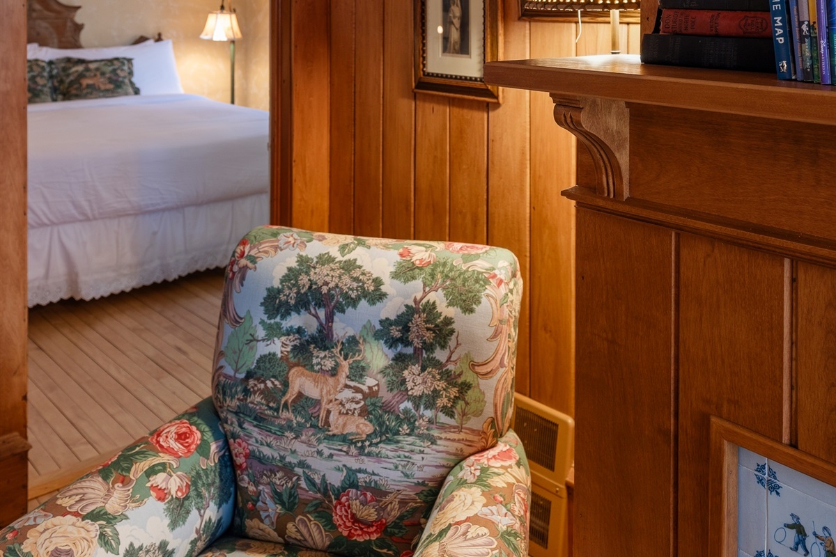 Bedroom corner w/ wood accents & cozy, cabin-style charm