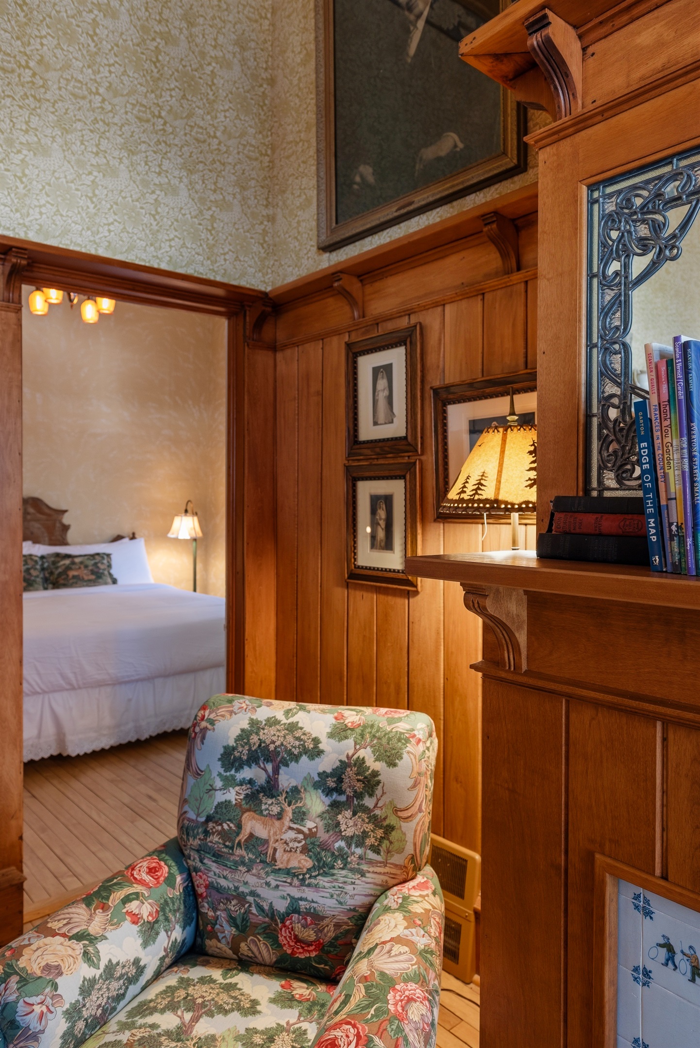 Bedroom corner w/ wood accents & cozy, cabin-style charm