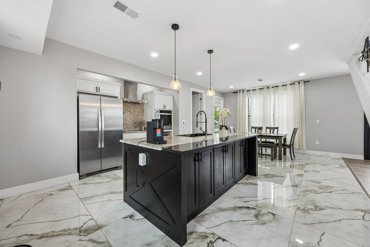 Bright open-concept kitchen at the heart of the home