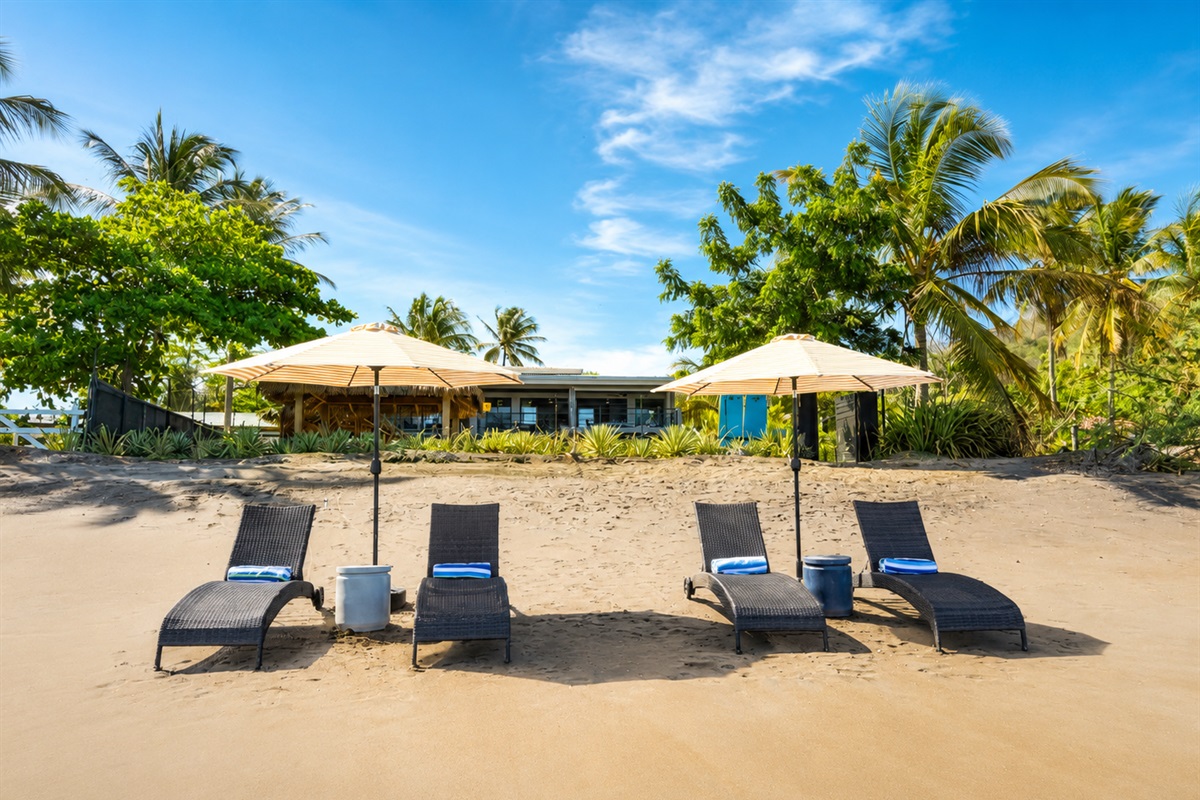 Lounge on sand directly in front of the villa 
