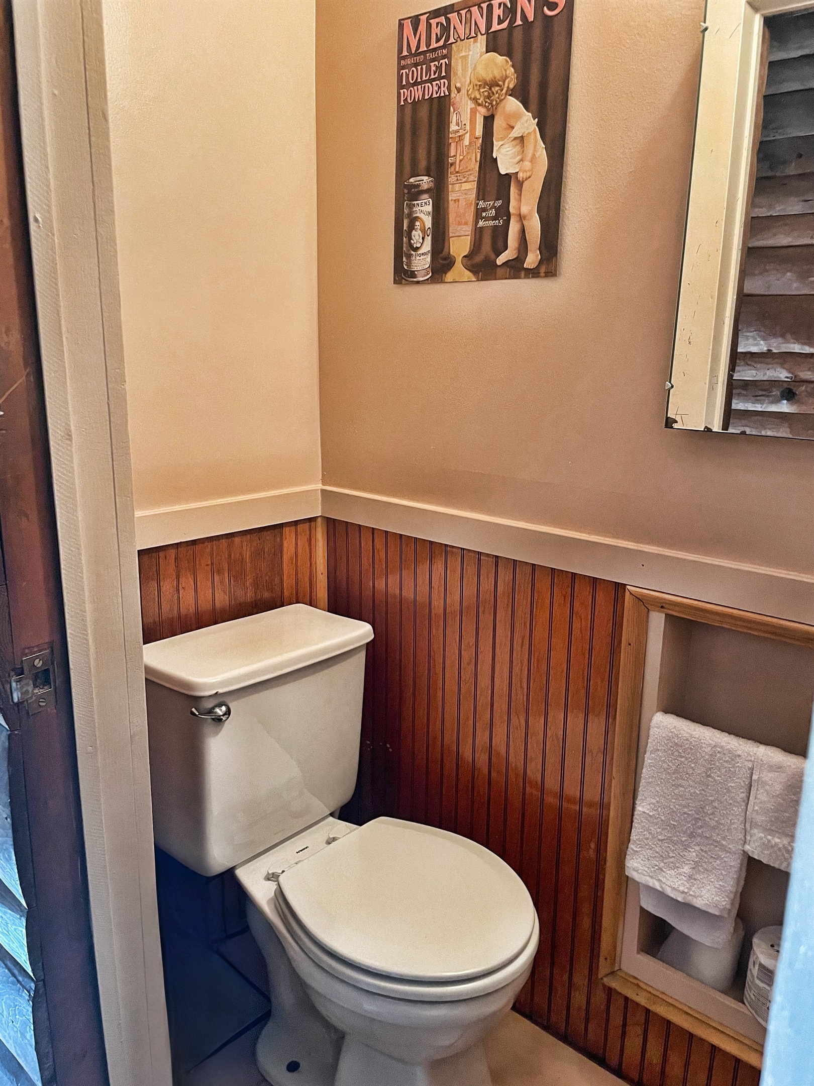 1st floor half bath off hallway just  across the hall from 1st floor king bedroom #1.