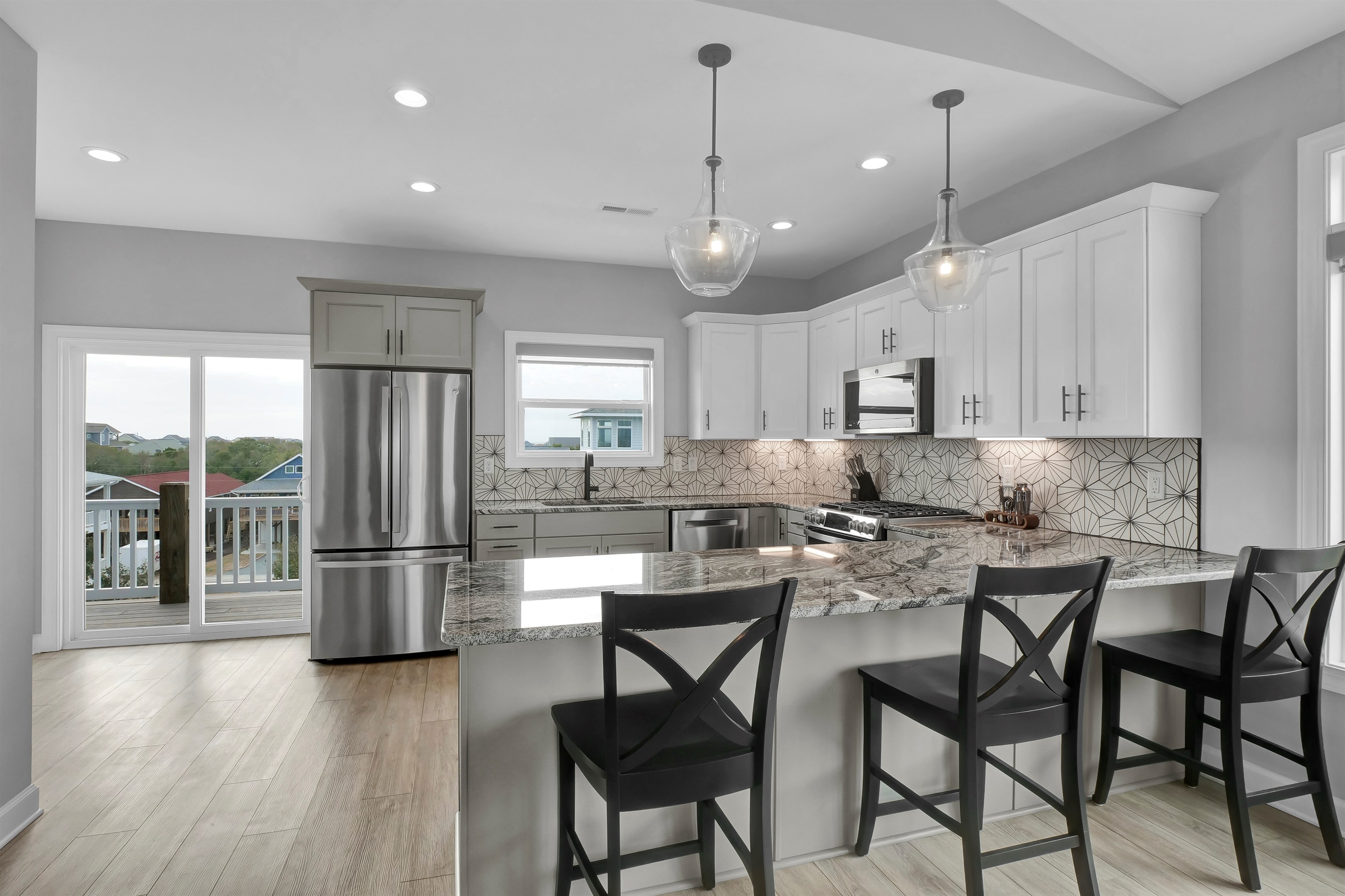 Spacious gourmet kitchen with modern appliances and plenty of counter space for culinary creations and dining.