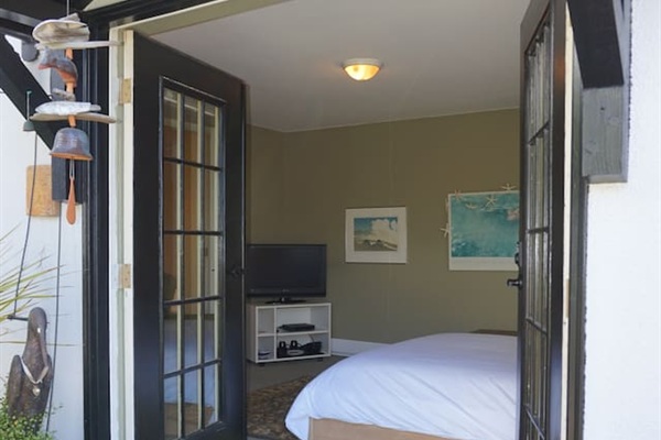 Private entry with door code for guest room downstairs.   French doors leading to the garden.