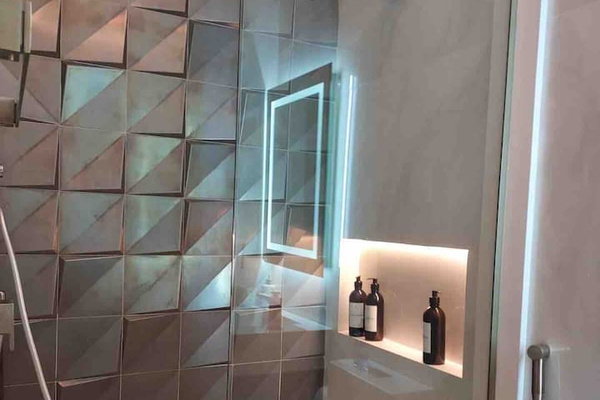 Full bathroom near sauna and BBQ.