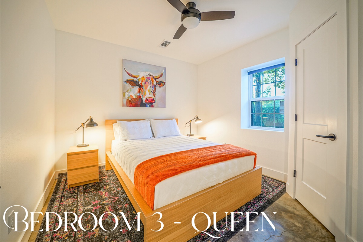 Chic and cheerful, this queen suite features fun art, natural light, and cozy textures — perfect for couples or solo guests.