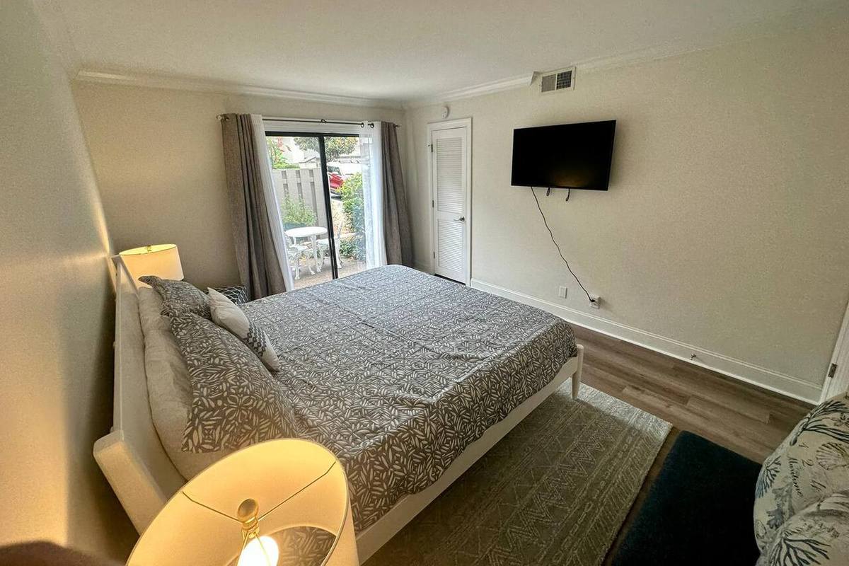 Bedroom with wall-mounted TV