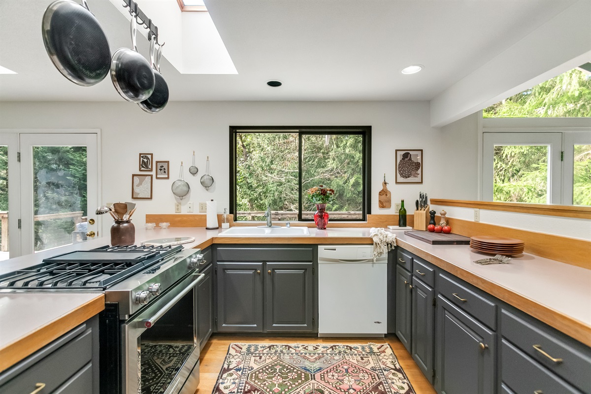 Natural light pours in through the skylights to illuminate the kitchen area.