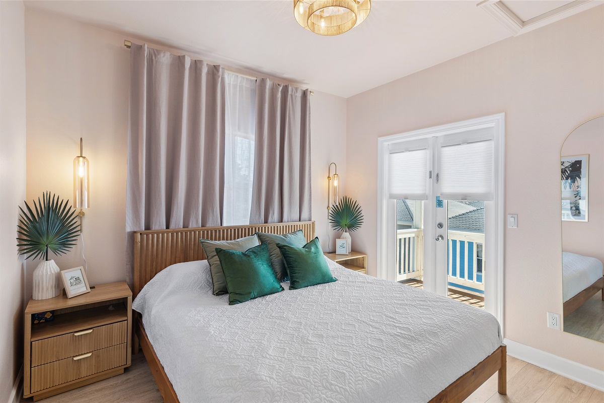 Bedroom 1 (Level 3): King bed, Smart TV, Chair + Desk, Balcony Access, Hallway Bathroom with Shower Tub Combo shared with Bedroom 2 (Sleeps 2)