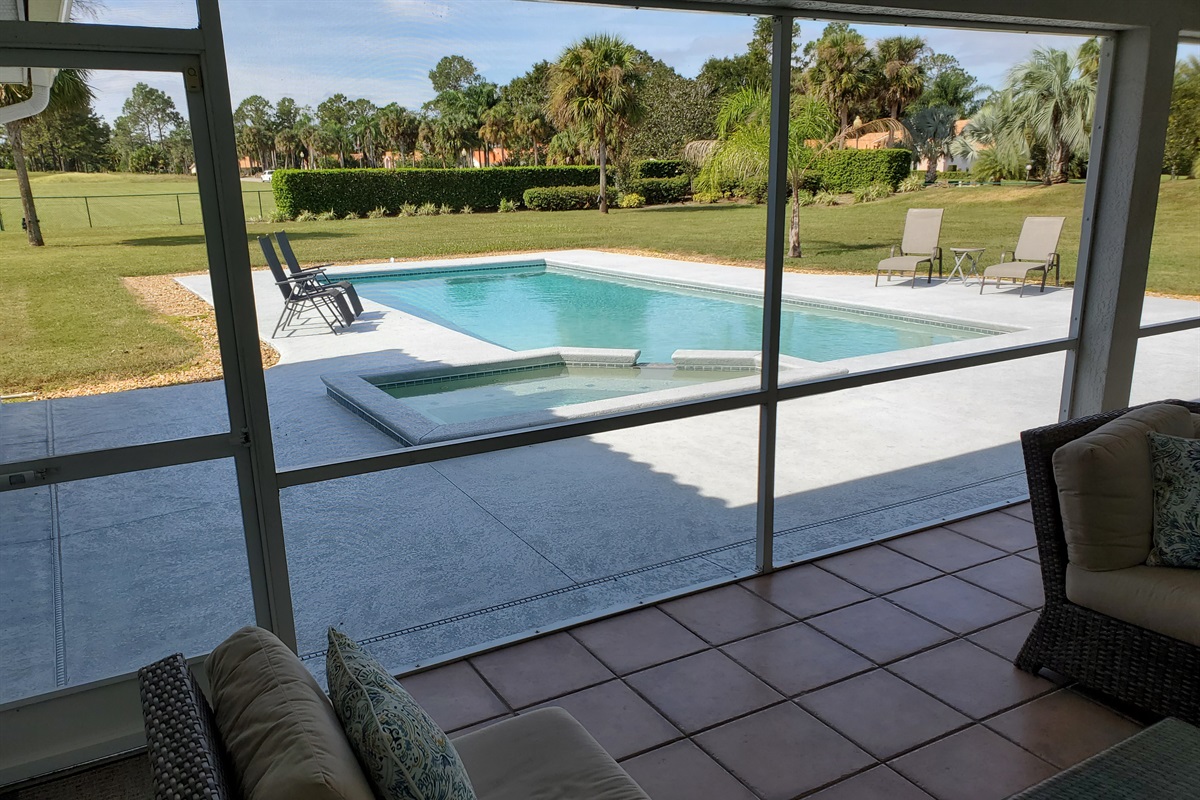 View of pool and backyard from Lanai
