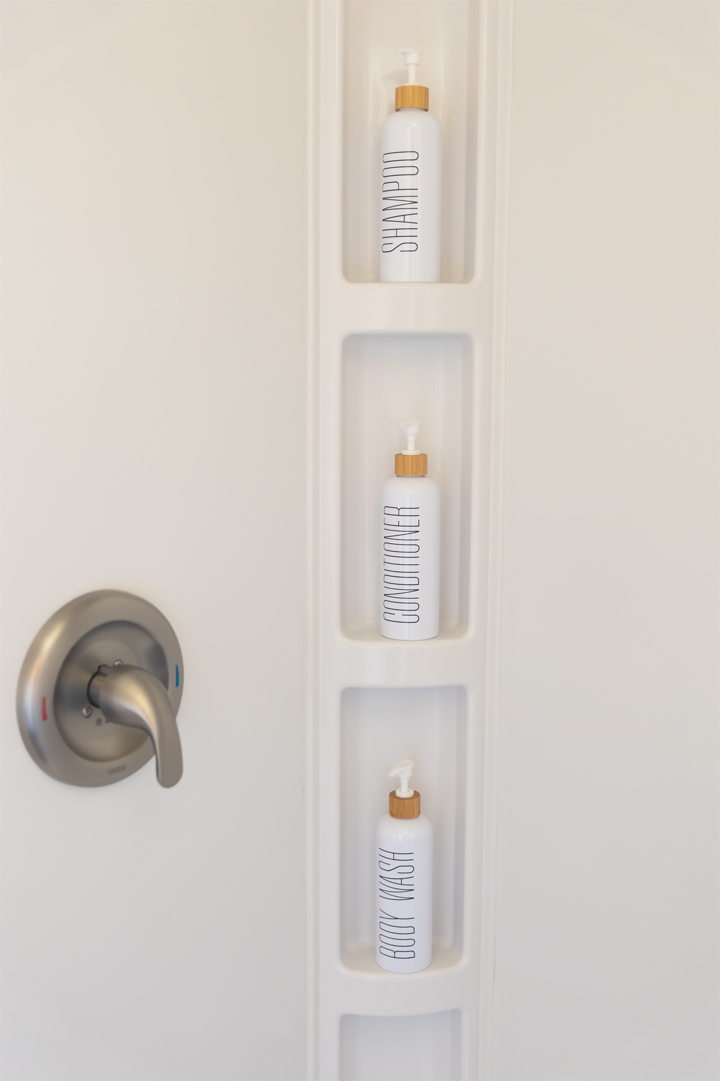 Shower with shampoo, conditioner and body wash provided