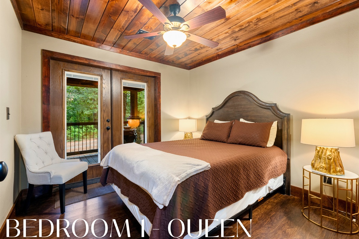 Bedroom 1: queen bed with deck access—sweet dreams in style.