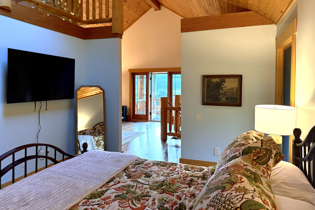 Apartment bedroom with a queen bed