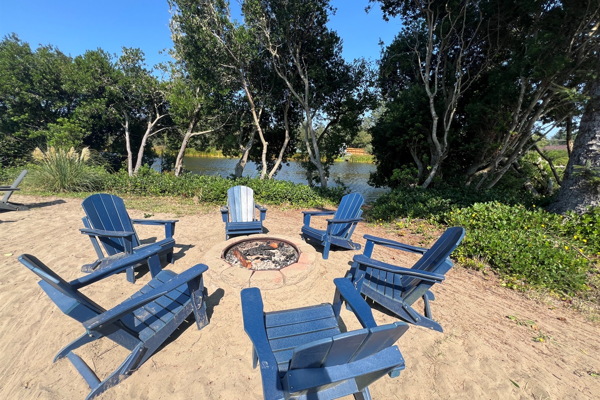 A calm sandy beach and fire pit to roast marshmallows and watch the water ripple by...