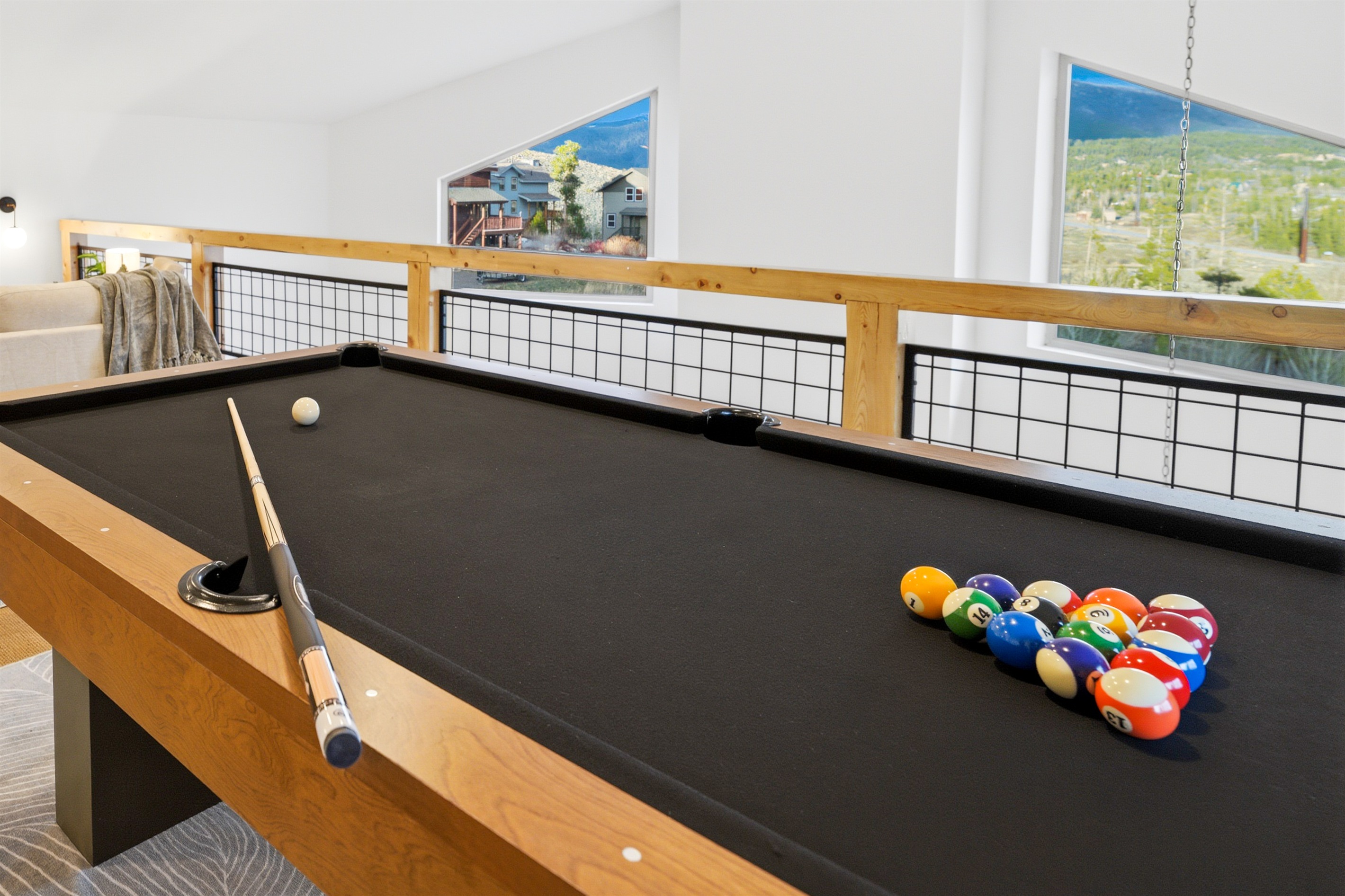 The upstairs loft is the ultimate hangout spot—where connection, comfort, and a little competition come together.