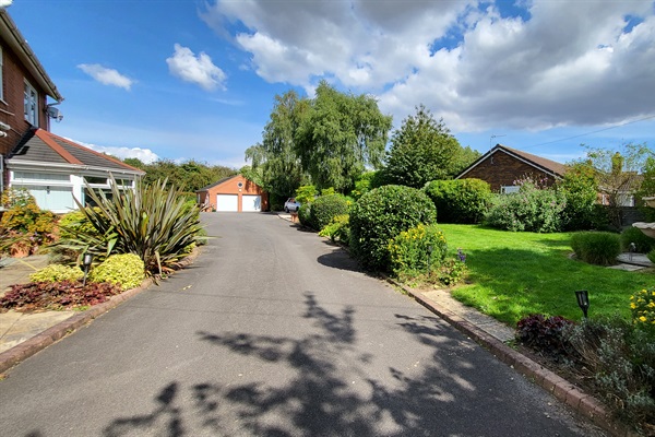 Extensive parking could accommodate 4-10 cars and driveway + patio access to ground floor entrances to the villa.