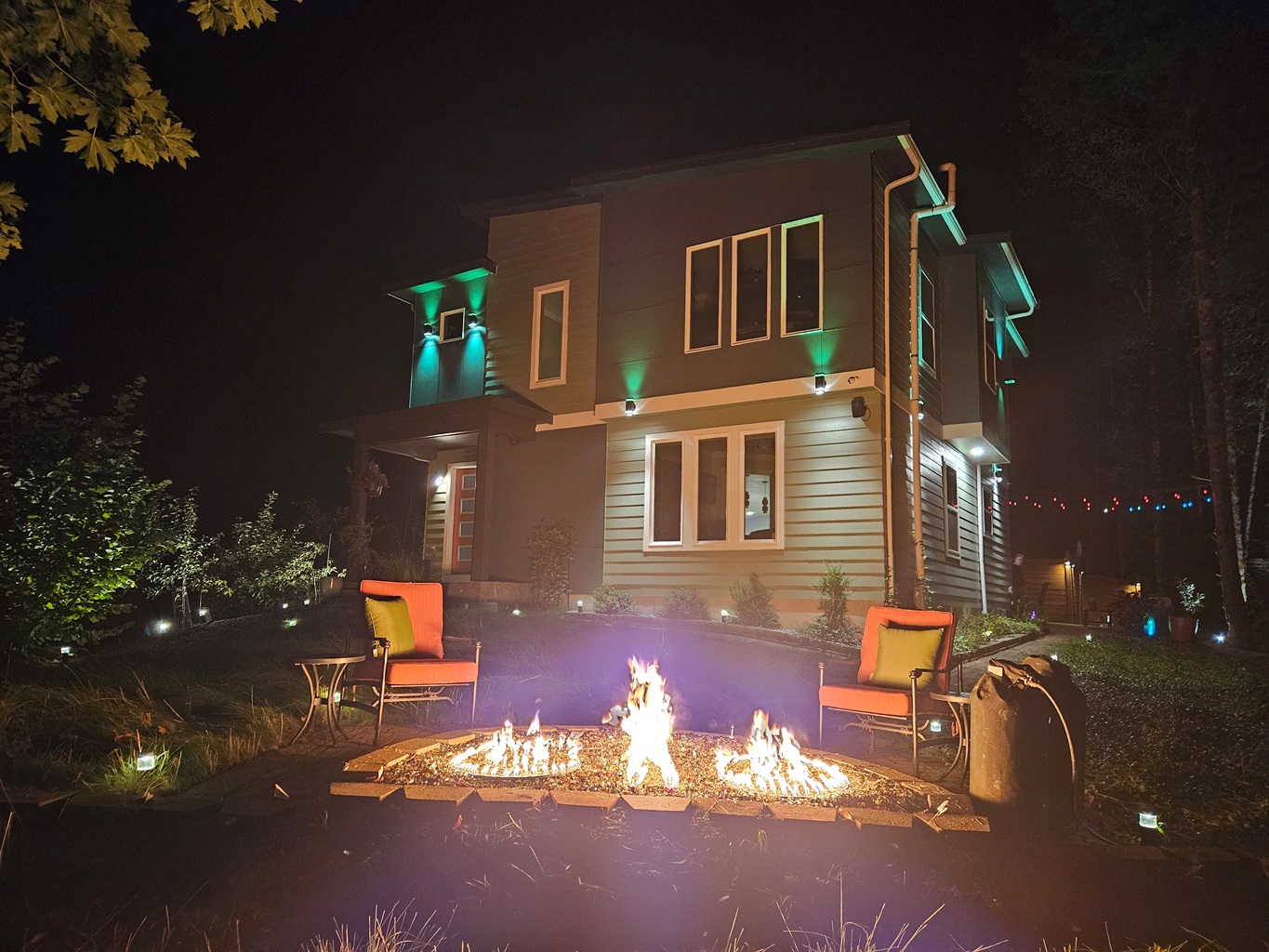 Stone firepit with shimmering fire glass.  Propane firepit is allowed during burn bans.