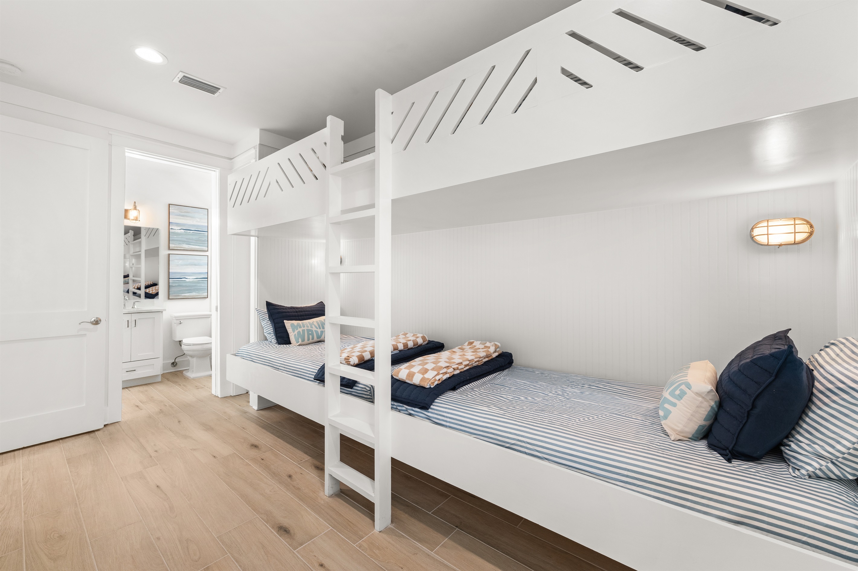 A favorite for kids and groups, this fun bunk room features four built-in bunks and a comfortable coastal atmosphere designed for memorable beach vacations.