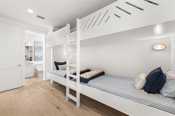 A favorite for kids and groups, this fun bunk room features four built-in bunks and a comfortable coastal atmosphere designed for memorable beach vacations.
