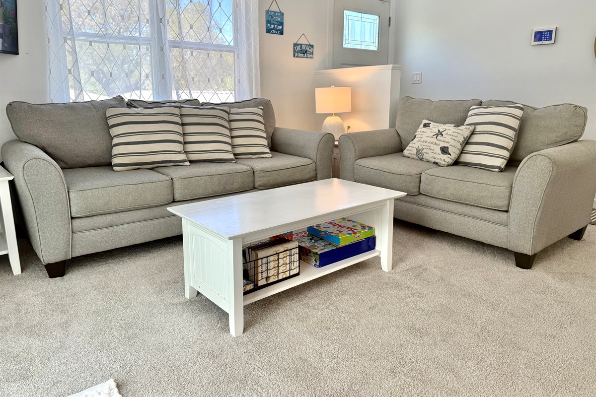 Step into this airy living room, featuring soft neutral tones, plush seating, and coastal-inspired décor that instantly puts you in vacation mode.