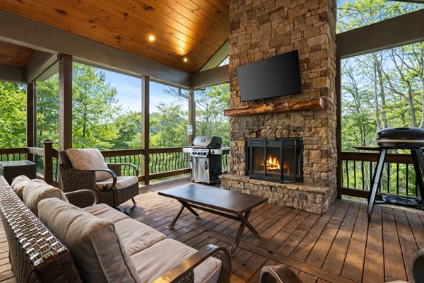 Cozy up by the outdoor fireplace on the party porch, a perfect spot for crisp evenings.