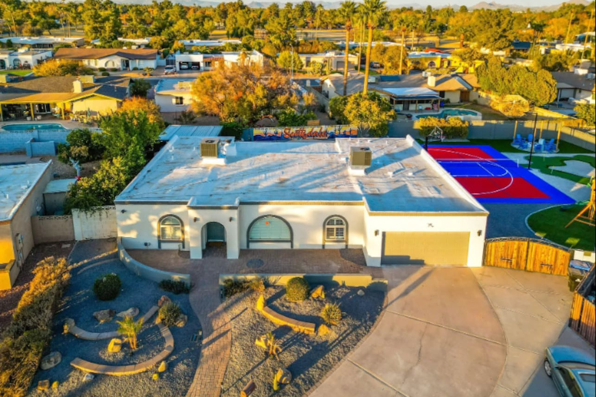 A classic Southwest facade with desert landscaping out front — a quiet first impression before the backyard steals the show.