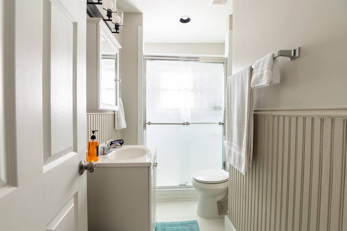 Fresh and Modern: Our elegantly designed bathroom features a luxurious walk-in shower with contemporary fixtures.