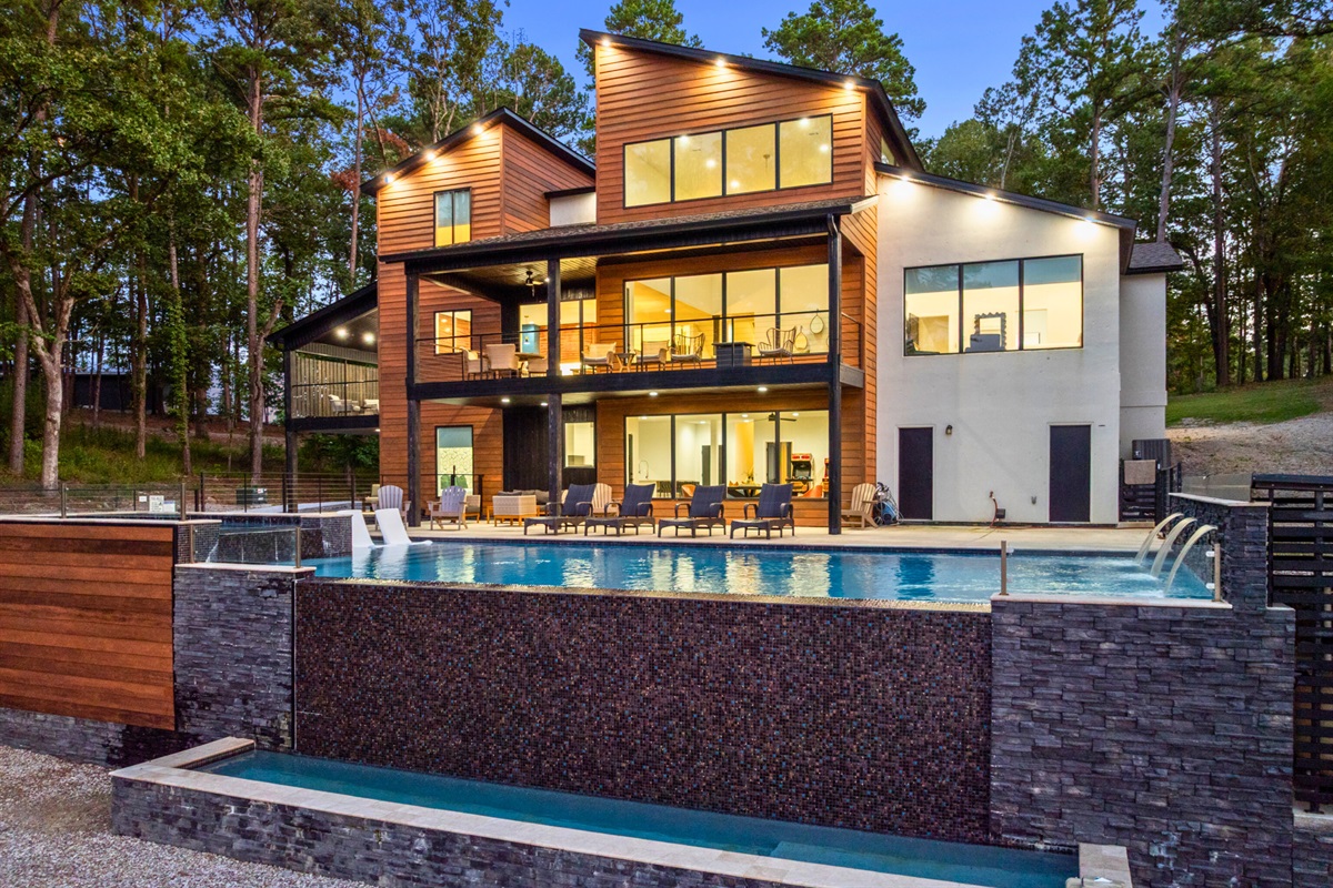 Infinity pool luxury meets modern architecture—pure lakeside perfection.