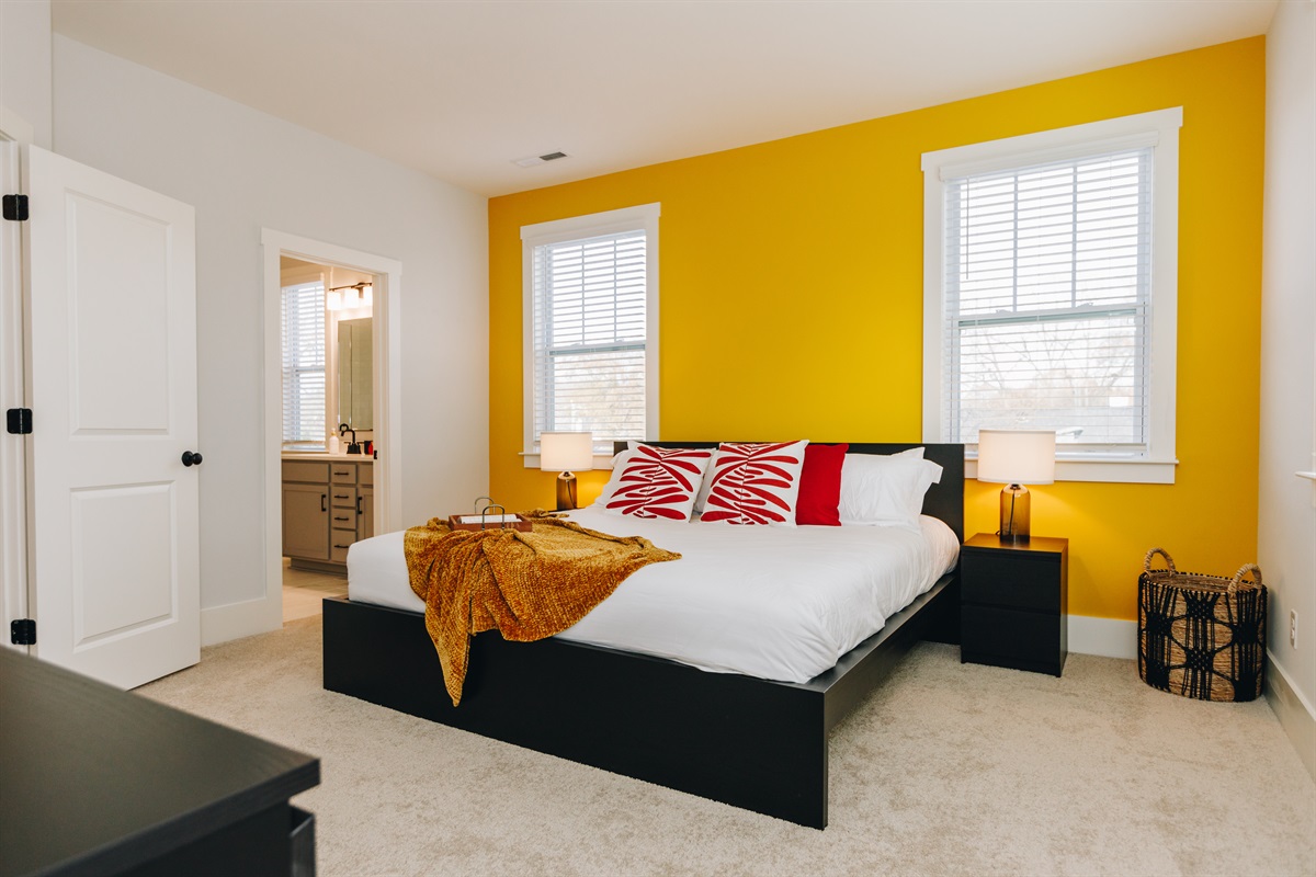 The master suite features a king bed, plenty of pillows and luxurikous linens, and has a large ensuite bathroom.