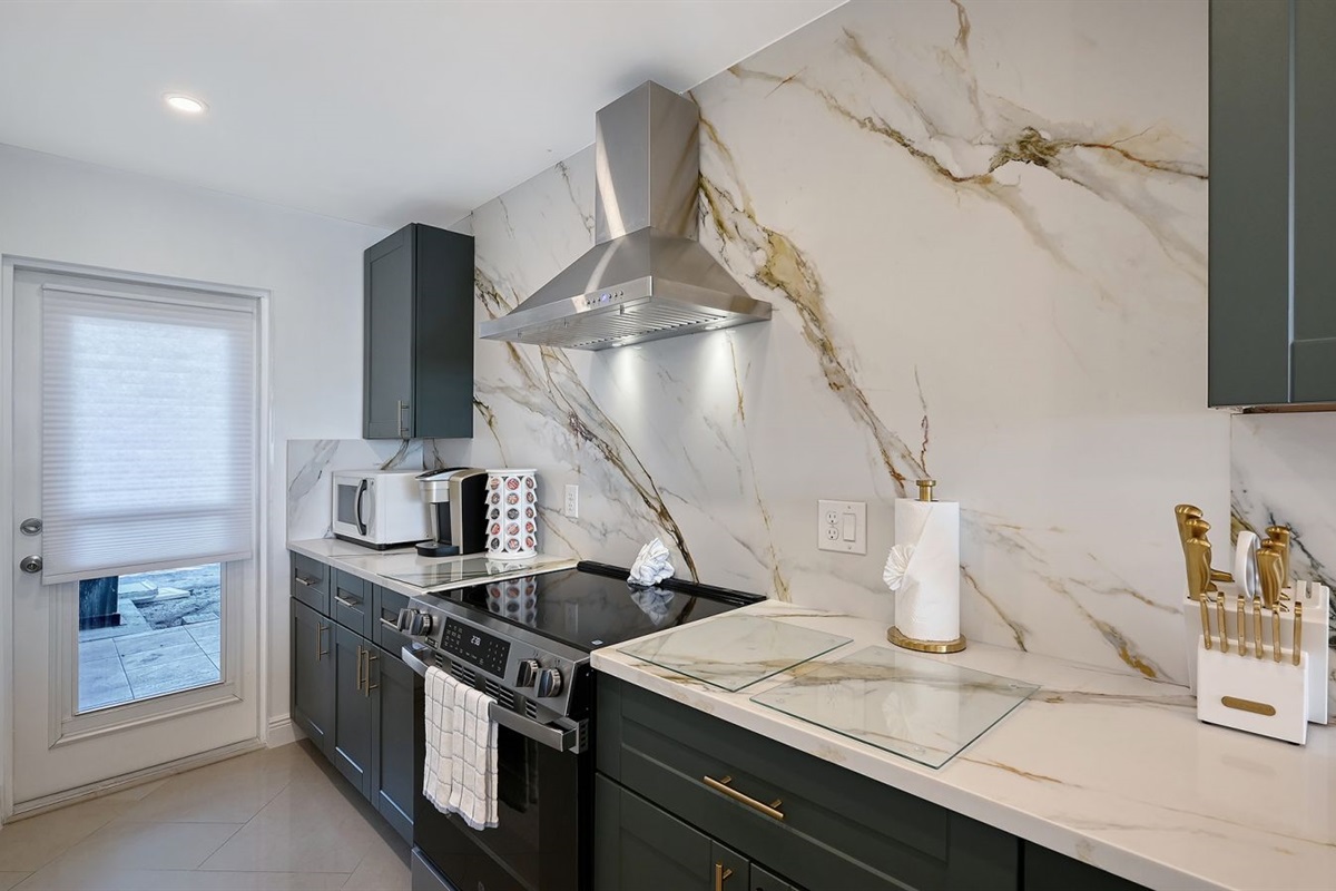 Kitchen with soft closing harvest green cabinets
