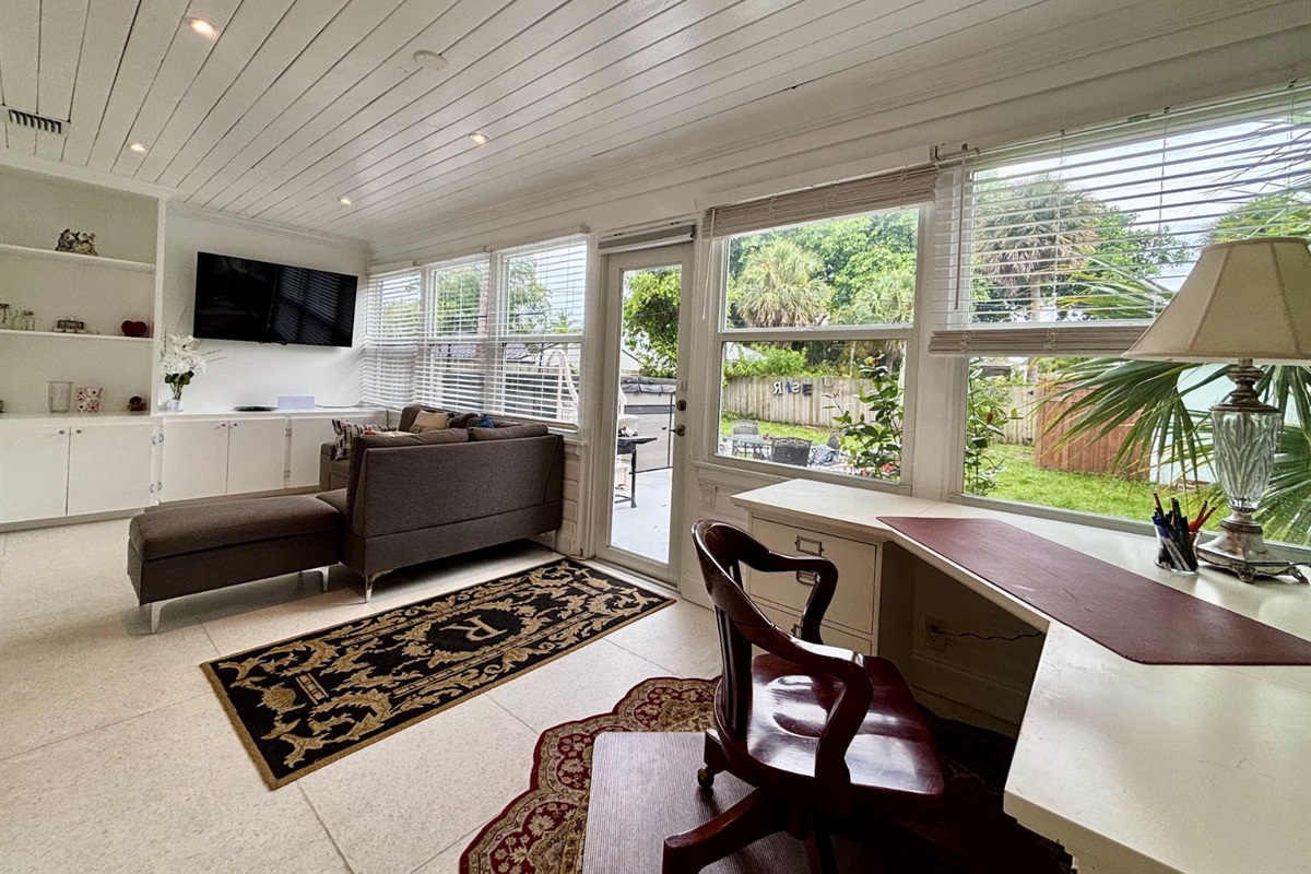 The workspace is located in the "Florida Room", with your desk overlooking the tropical scenery..