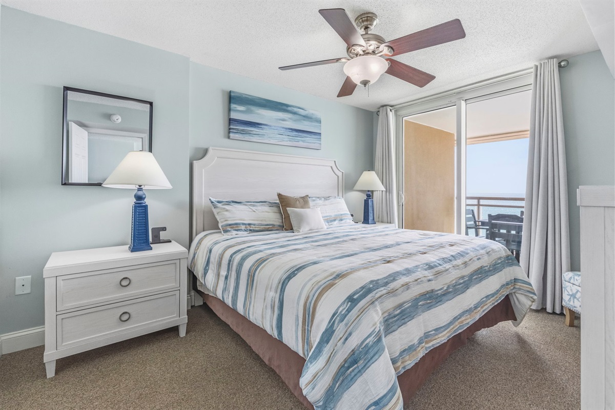 Primary Bedroom with King Bed, ensuite bathroom, and balcony with direct oceanview