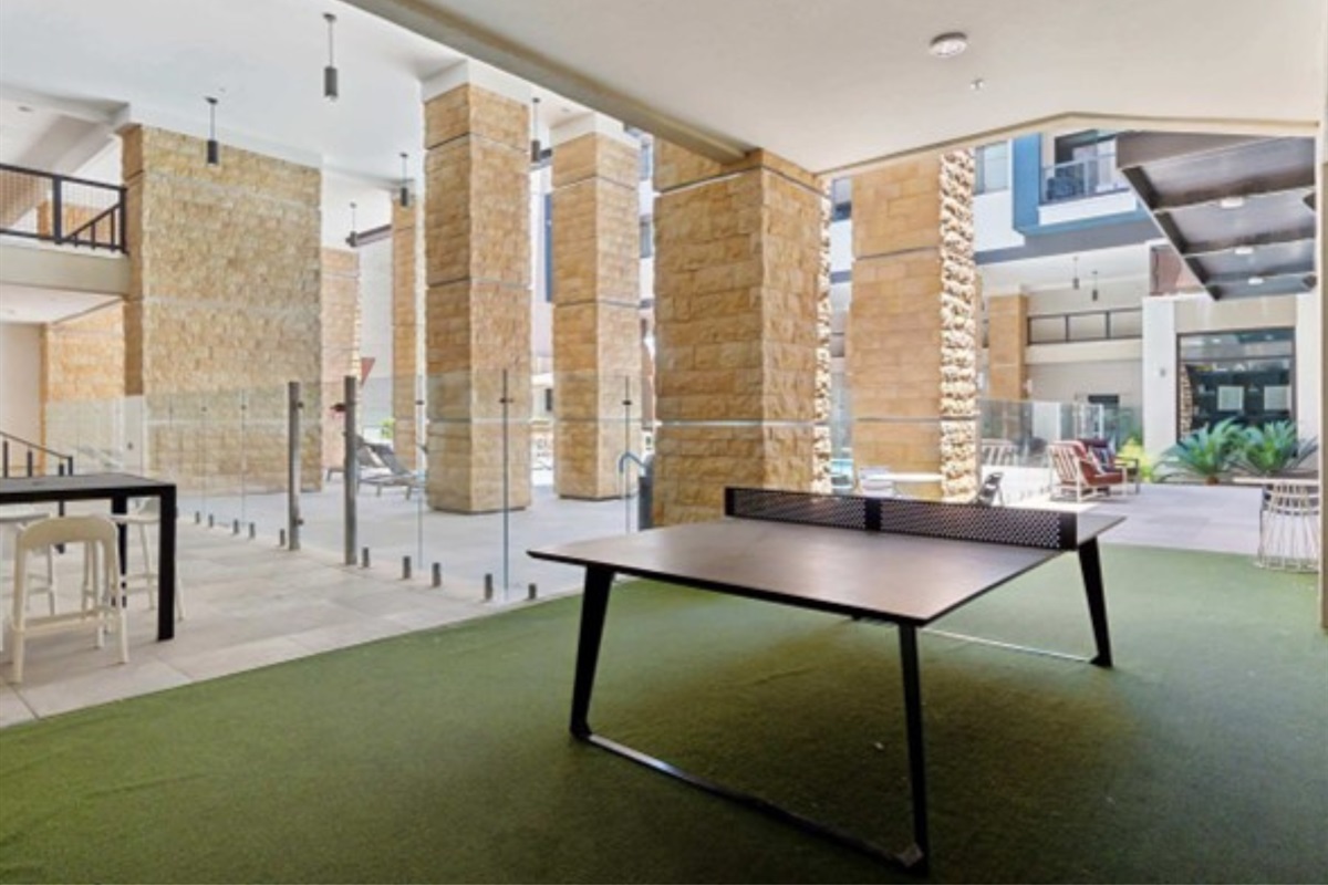 Have fun in the vibrant game room featuring billiards, board games, and a casual hangout vibe.