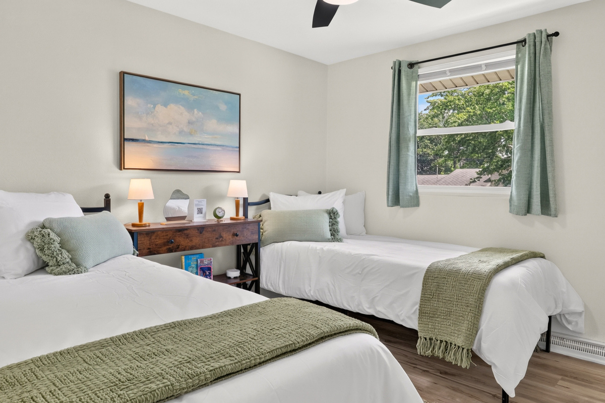 Second bedroom with two comfortable XL Twin beds—great for families or work crews.