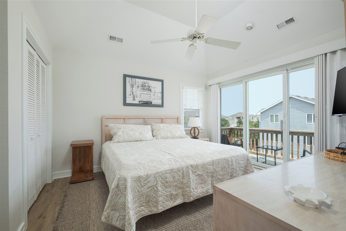 3rd Floor King Bedroom with ensuite full bathroom, deck access, and plenty of natural light