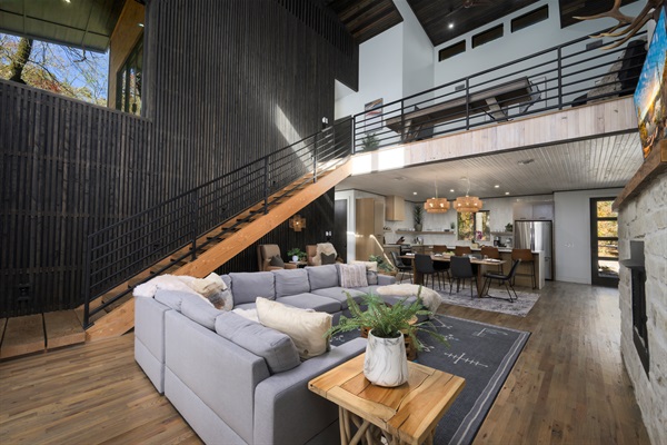 Open-concept living at its finest—soaring ceilings, modern architecture, and a seamless flow from lounge to kitchen