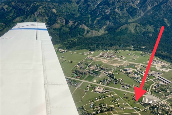 Pilots Welcome! From the sky, the beauty of Alpine, WY is on display - framed by mountains, and that little dot the arrow's pointing to? That's Alpine Airspace vacation rental home - home base for days of exploring.