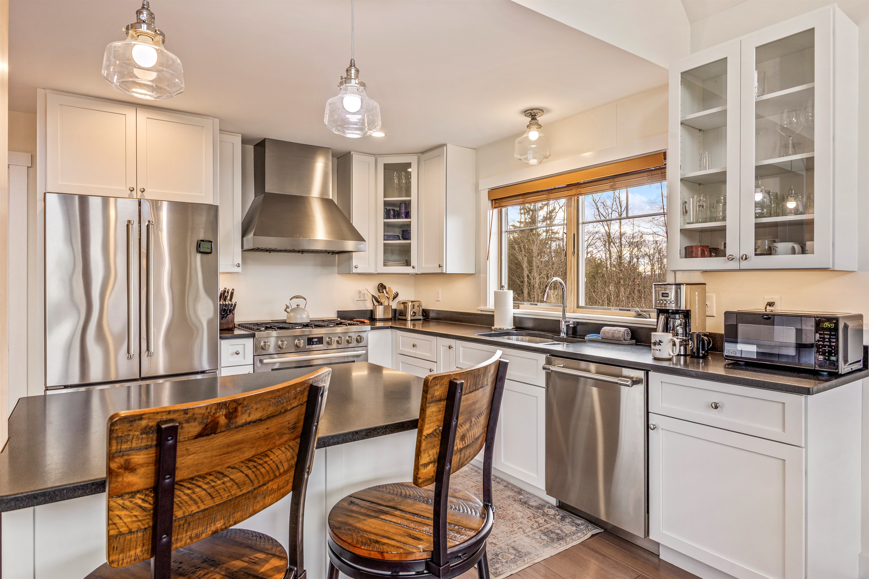 Prepare meals with ease in the modern kitchen, featuring an island with extra seating for friends and family.