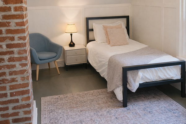 This cozy bedroom features two comfortable twin beds, making it a great space for kids, friends, or additional guests. Thoughtfully furnished for a restful night's sleep, it offers a comfortable and inviting place to recharge after a day of exploring Napa