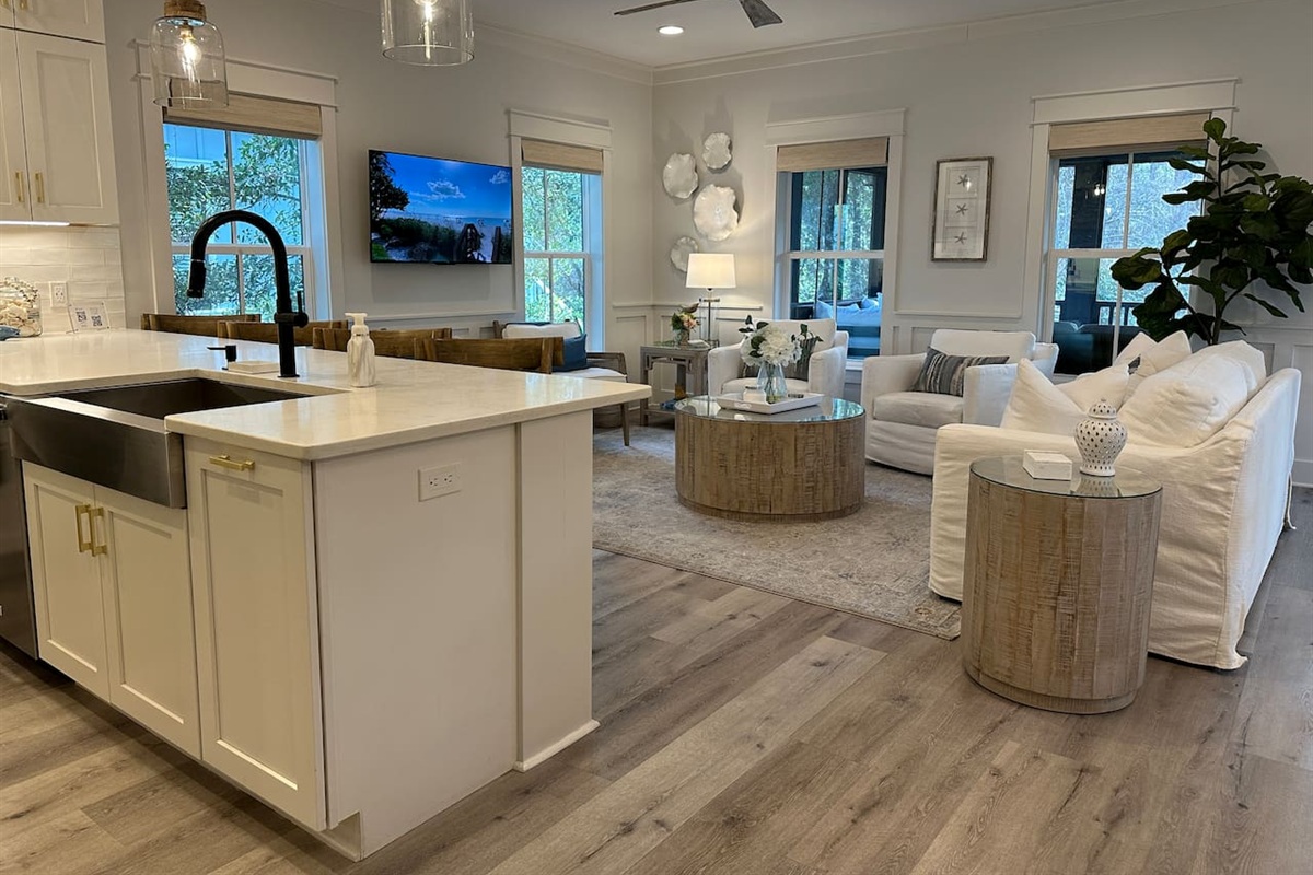 Spacious living area off full kitchen with seating at the counter for four guests