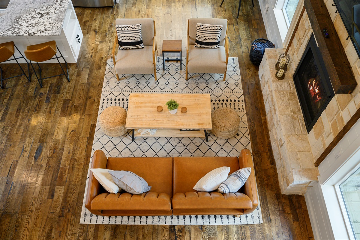 A bird’s eye view of where cabin memories are made.
Living room comfort with a little extra breathing room. 
Open, inviting, and wrapped in warm cabin charm, this is the kind of space where everyone naturally ends up together.