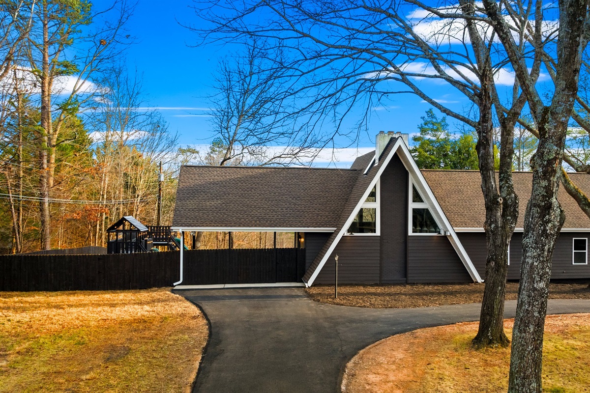 Arrive at the River Retreat and go through the gate to get to the front door.