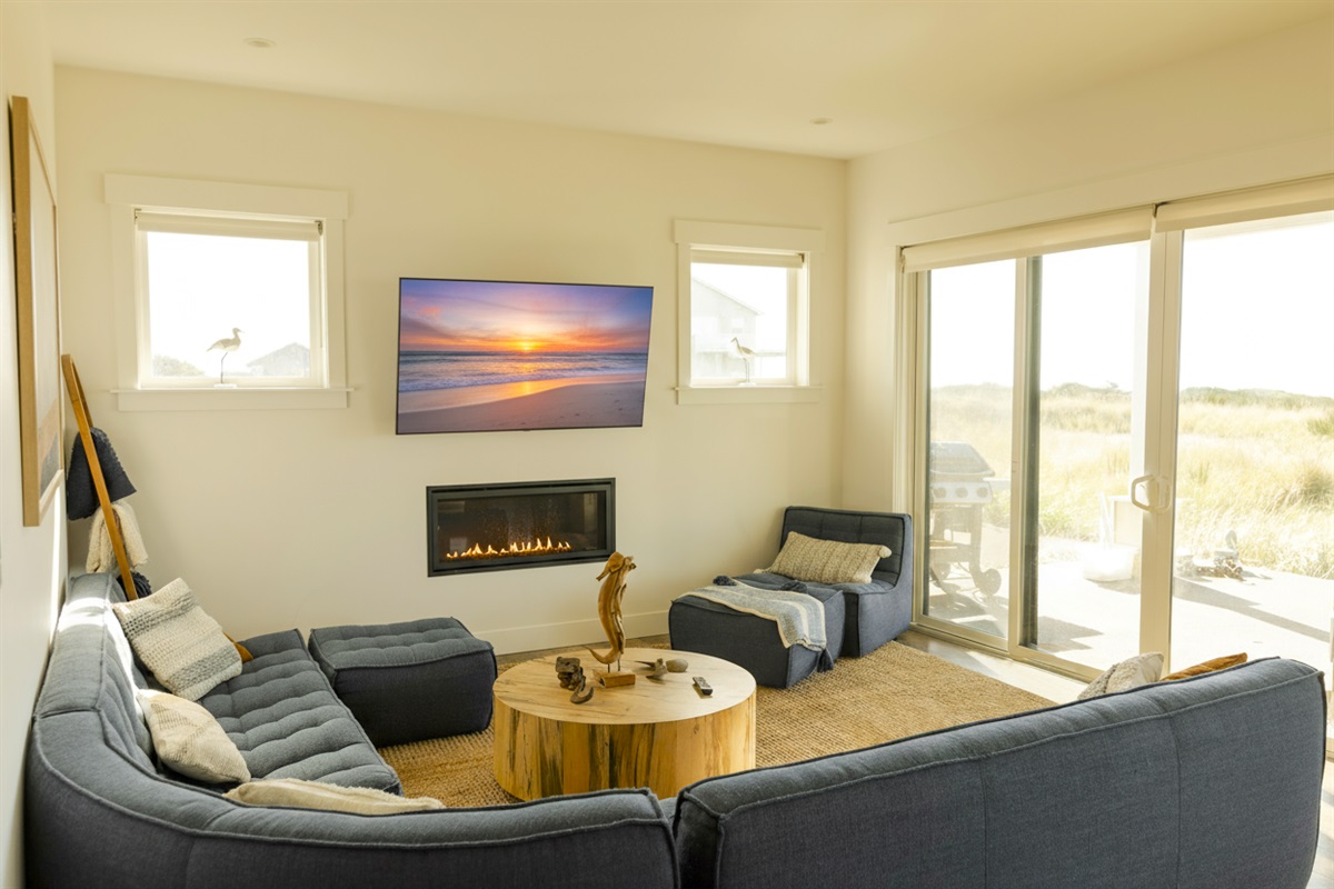{Living} Relax by the cozy, electric fireplace and take in the view or watch a movie with friends.