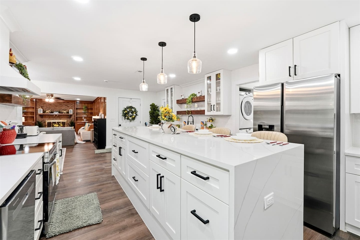 Beautiful white kitchen fully equipped with all the appliances and essentials of a home away from home.